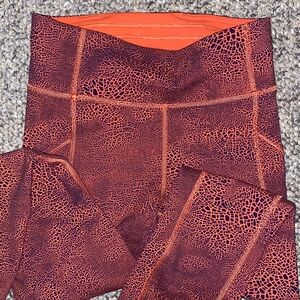Lululemon Invigorate High-rise Leggings In Crackle Glaze Vintage Orange Larkspur